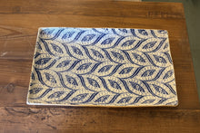 Load image into Gallery viewer, Rectangular placemat with blue leaf pattern on a wooden surface