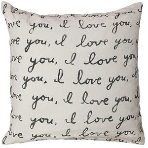 Sugrboo Designs cream color stonewashed linen square pillow, printed with multiple lines across front in black cursive font that repeat "I love you"  .  Rustic neutral look, comes with down insert 
